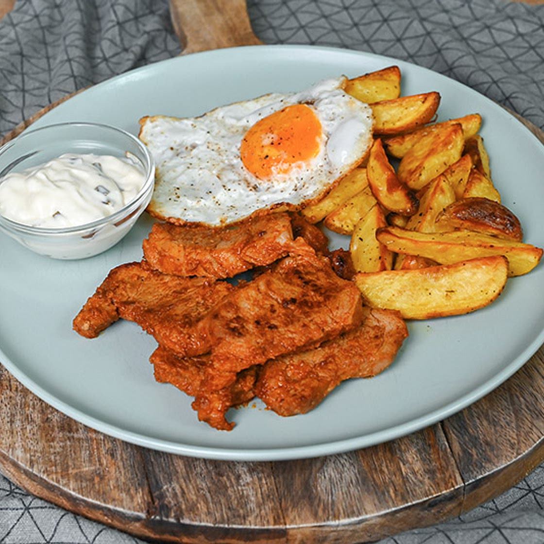 Pork Tenderloin Medallions Served With Crispy Potato Wedges