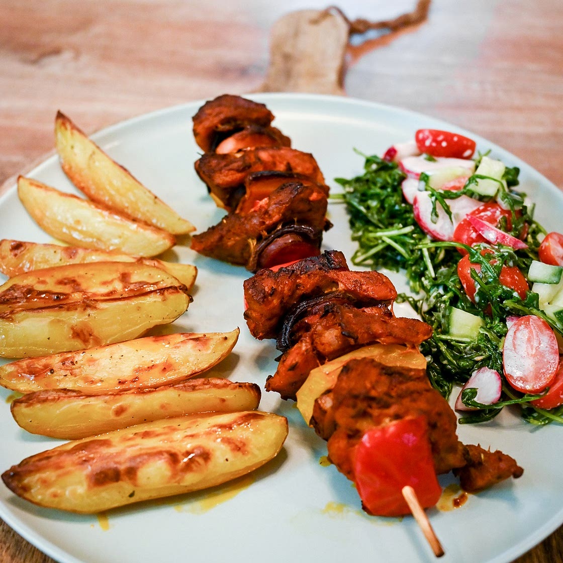 Pork Skewers With Baked Potatoes And Vegetable Salad