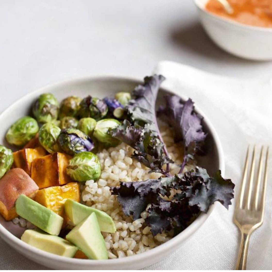 Carrot-ginger apple cider vinaigrette on a sweet potato avo bowl