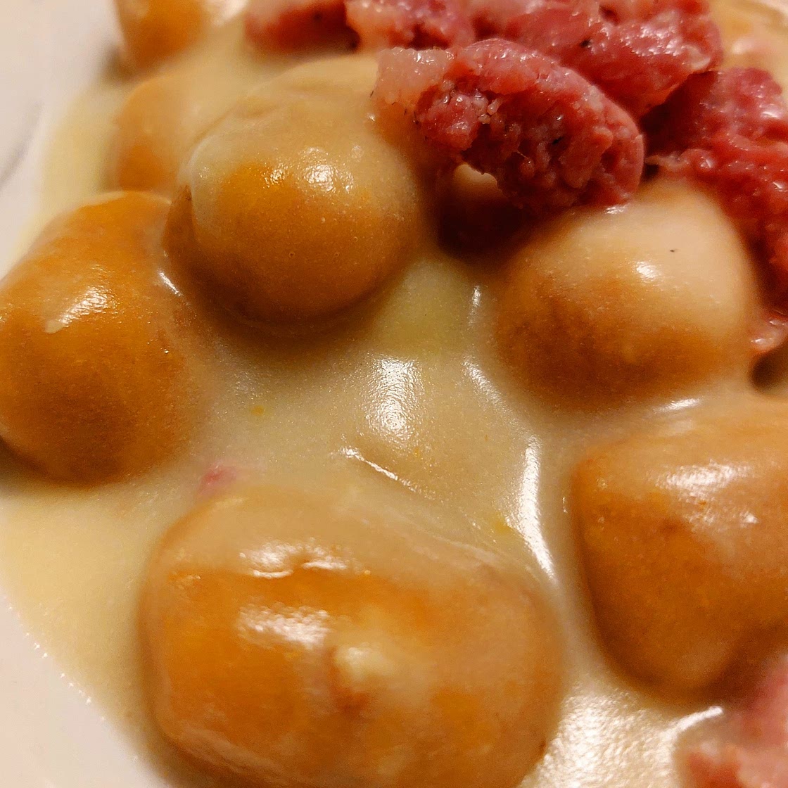 Pumpkin and ricotta gnocchi - potato cream and sausage