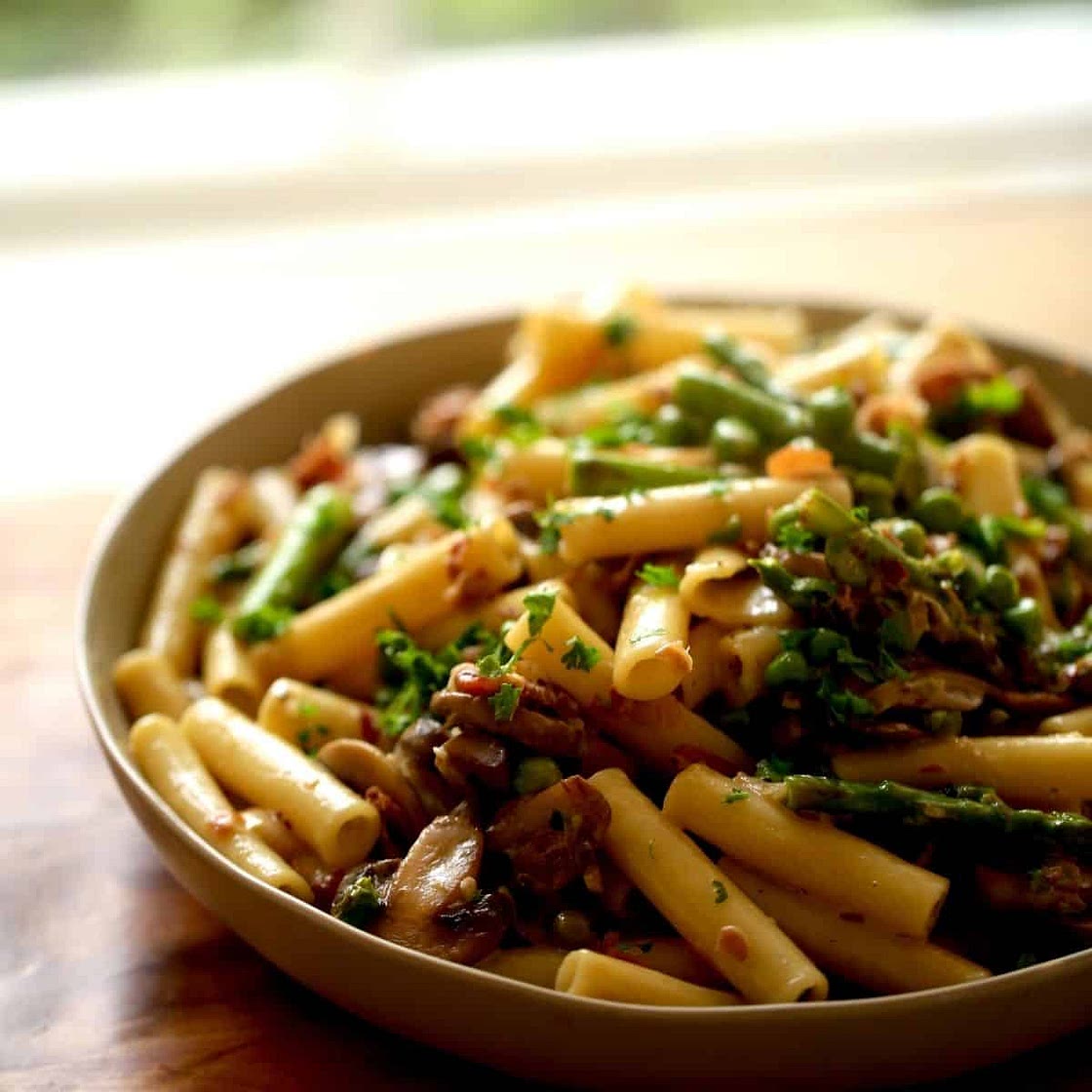 Spring Pasta Recipe with Crispy Prosciutto, Peas, and Mushrooms