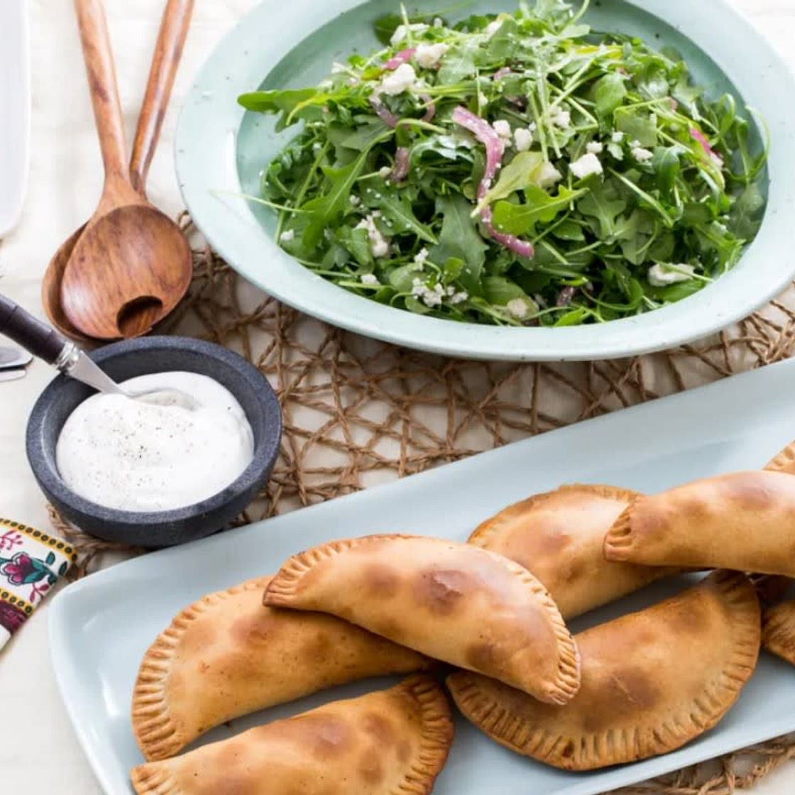 Baked Empanadas de Picadillo with Arugula, Queso Fresco & Pickled Onion Salad