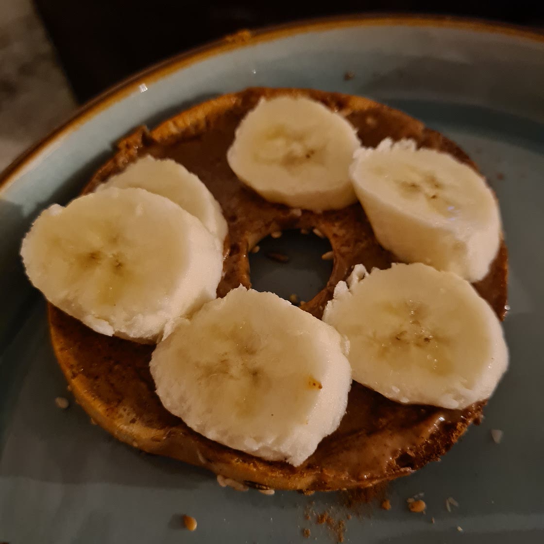 Almond butter and banana on a bagel