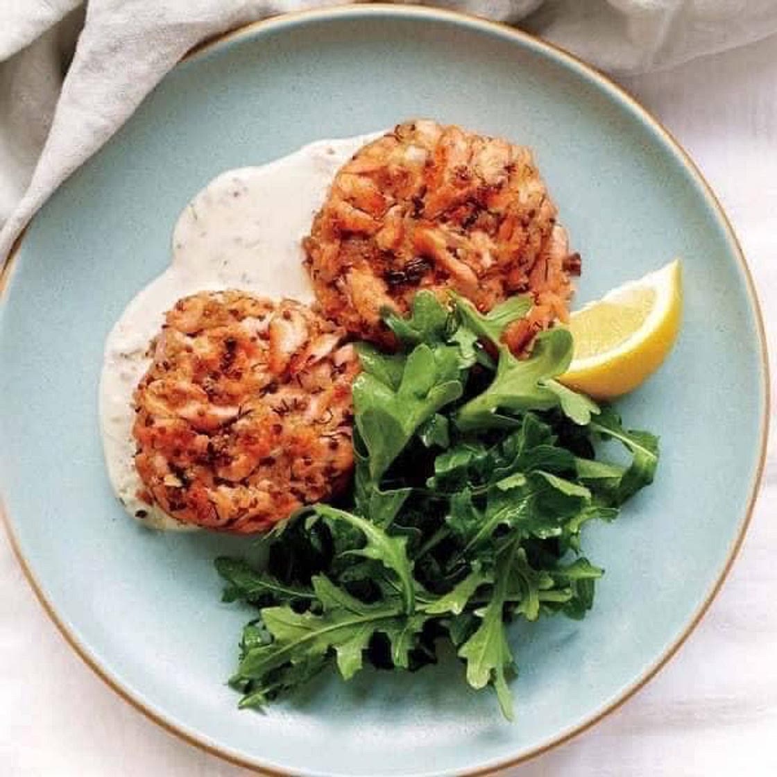 DIJON SALMON CAKES AND ARUGULA WITH LEMON–CAPER OIL