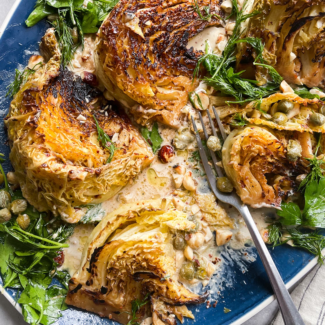 Braised Cabbage with Anchovy Butter, Tahini and Herb & Caper Salad