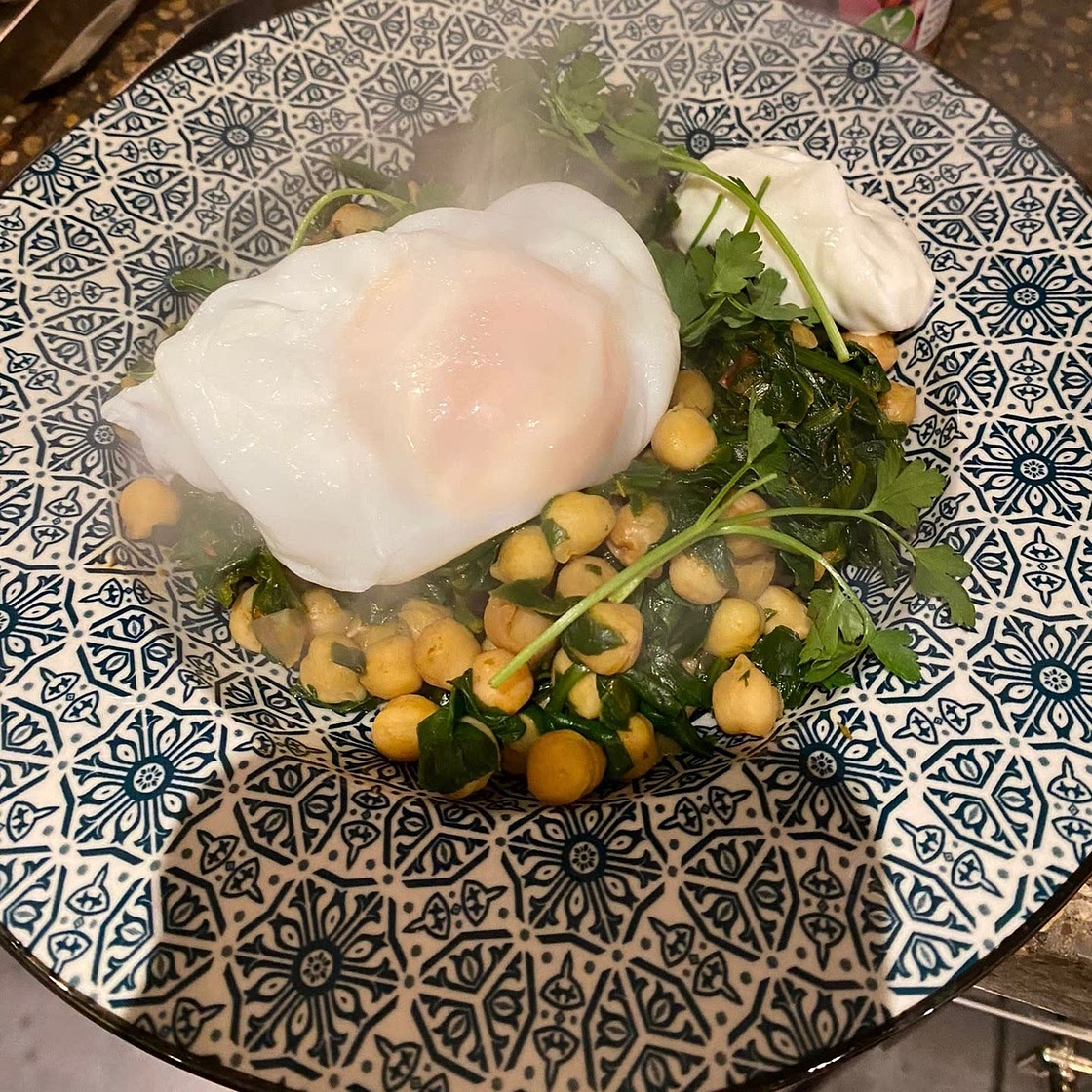 Poached eggs with harissa chickpeas and garlic yogurt