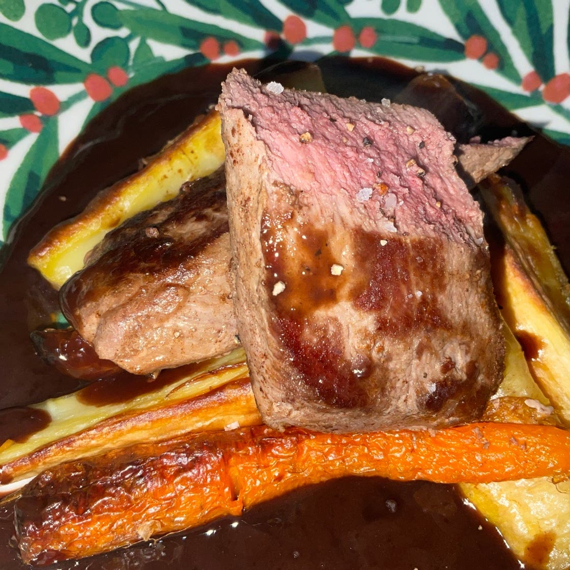 Venison Loin with a Red Wine and Juniper Sauce Served with Roasted Carrots and Parsnips