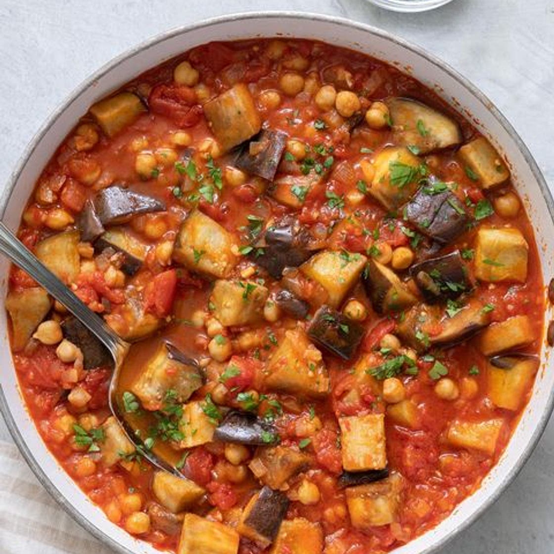 Dinner tonight should be this Middle Eastern Eggplant Stew filled with chickpeas and a harissa tomato base. It's quick, easy, and ready in just 30 minutes! INGREDIENTS 4 tablespoons olive oil divided 4 cups eggplant cut into 1-inch cubes ¾ teaspoon salt di