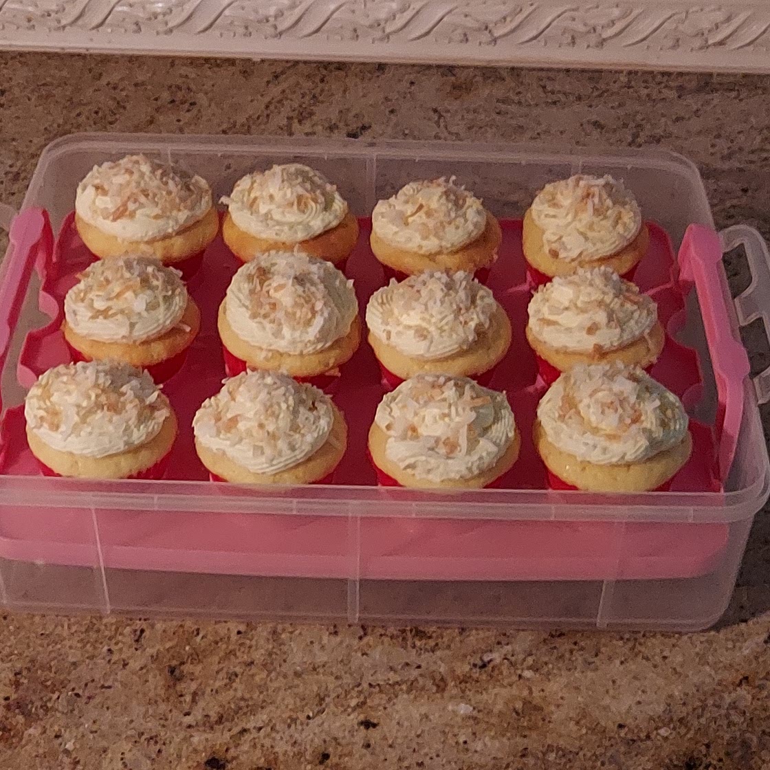 Coconut cupcakes with coconut whipped cream icing