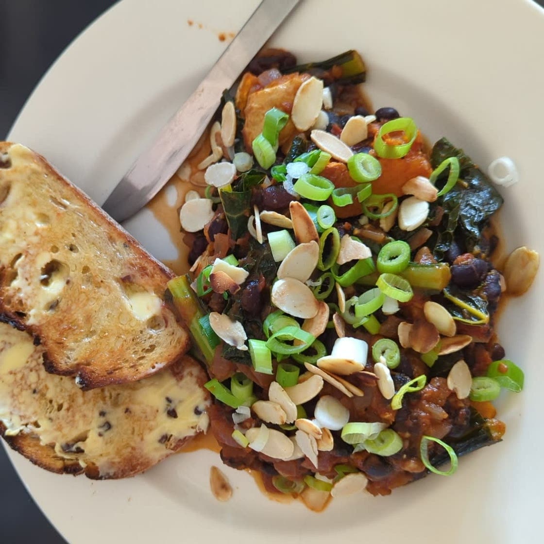 Black bean & Sweet Potato Stew with Cavolo Nero & Harrissa
