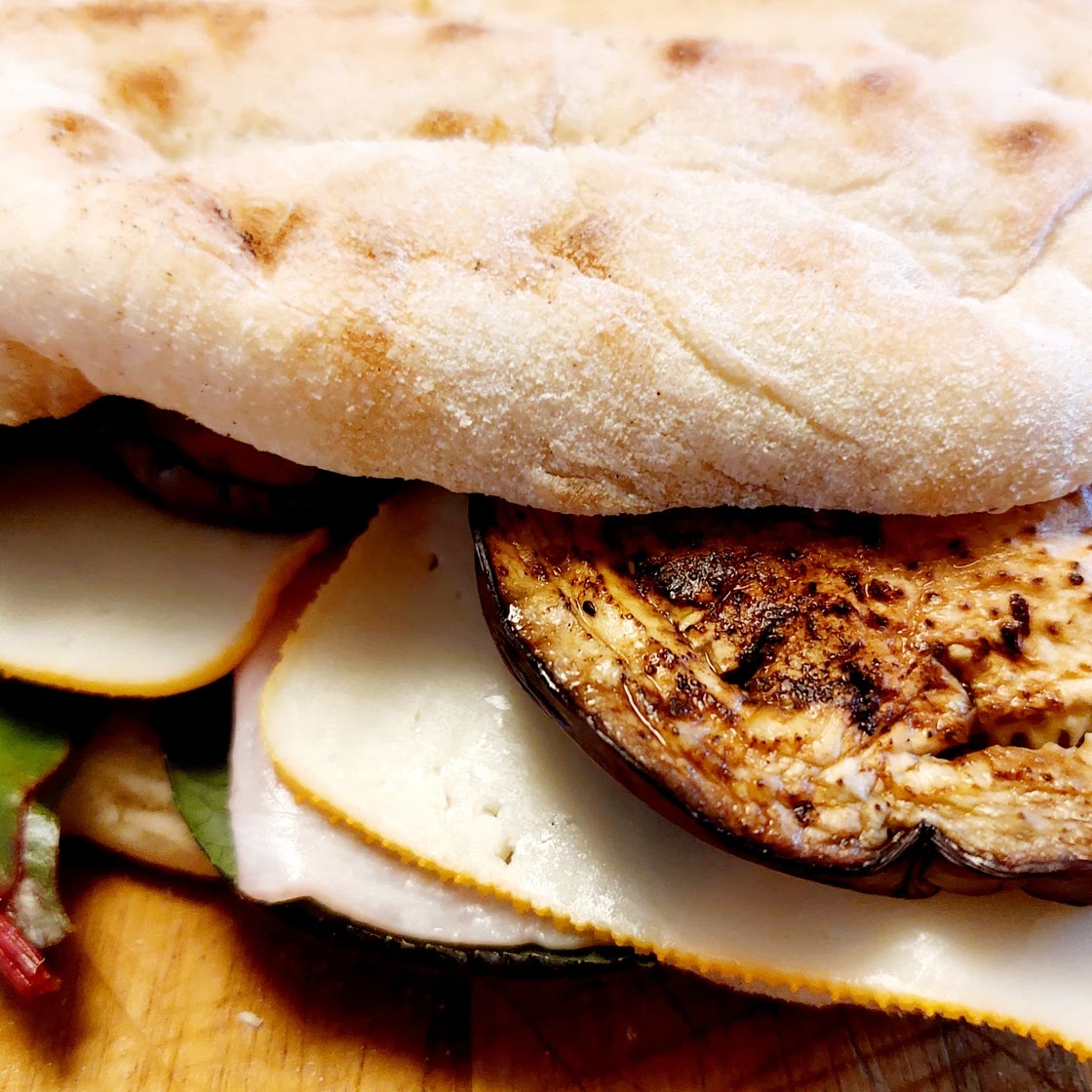 Panini - grilled eggplants, ham and edam cheese sandwich