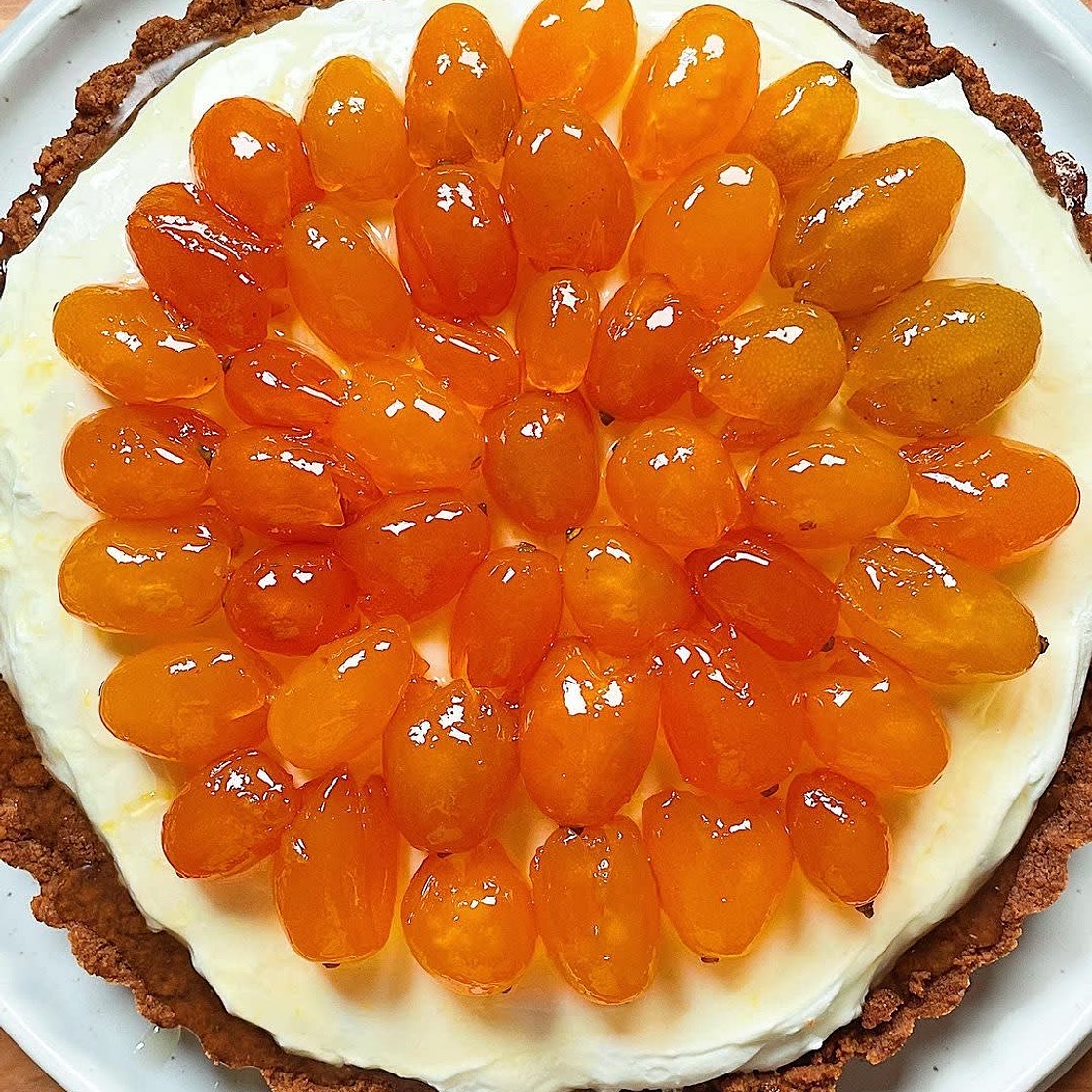 NO-BAKE CHEESECAKE with candied kumquats and brown butter cookie crust