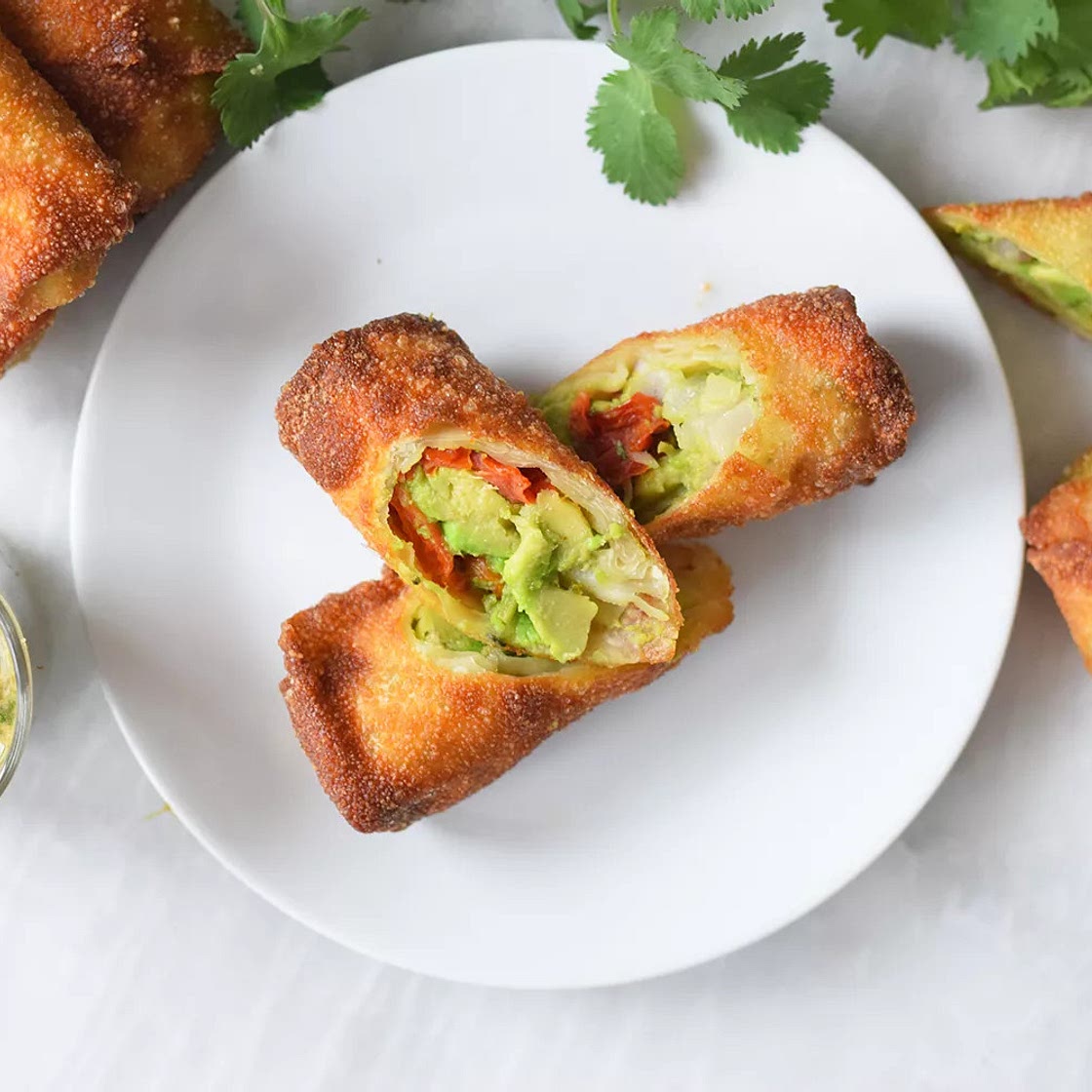 Avocado eggrolls with tamarind cashew dipping sauce