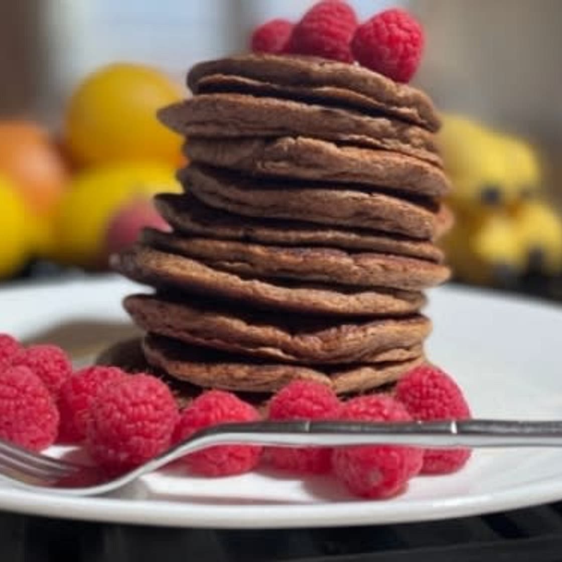 Low calorie healthy banana oat pancakes with Raspberries
