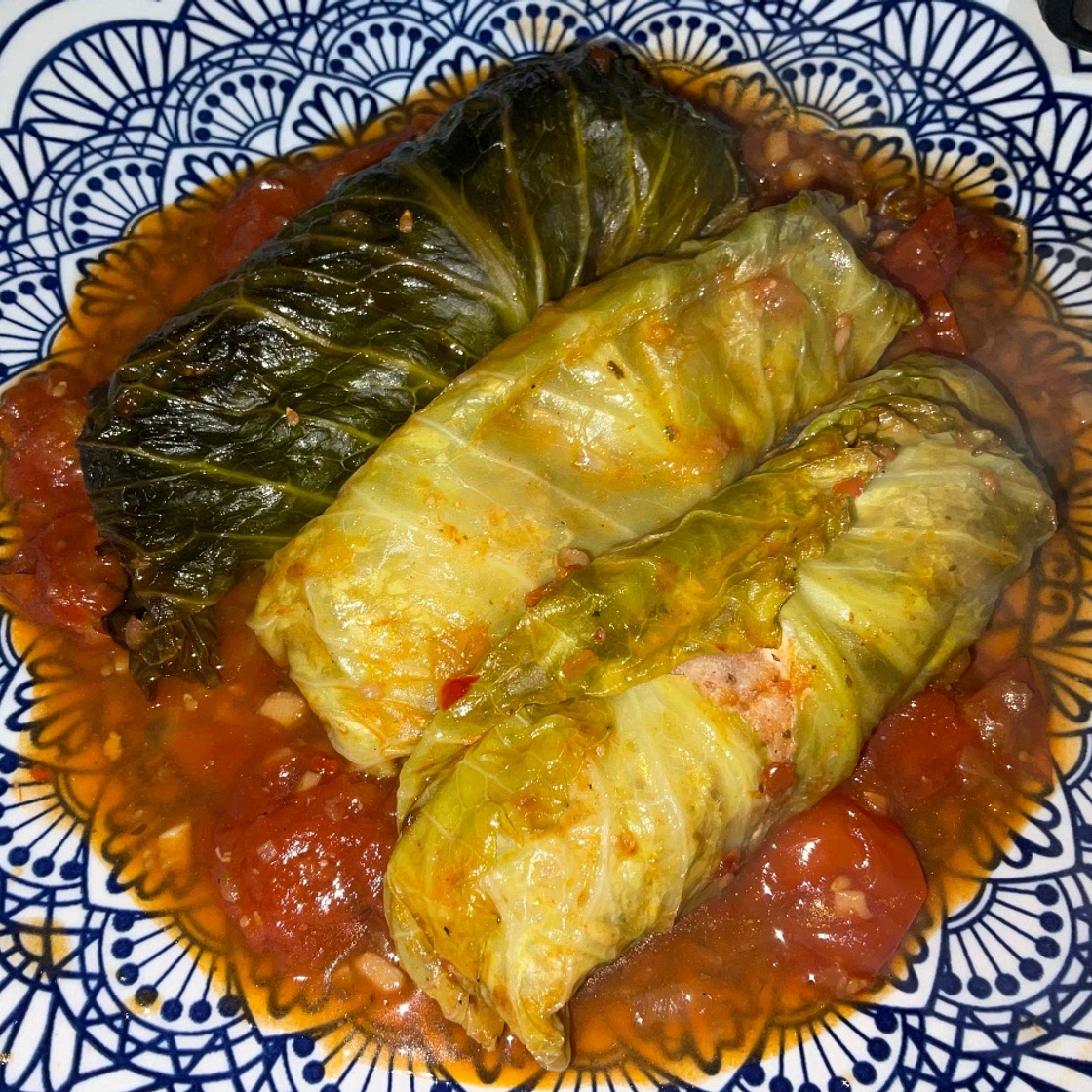 Pork Stuffed Cabbage Rolls on a Cherry Tomato and Garlic Sauce
