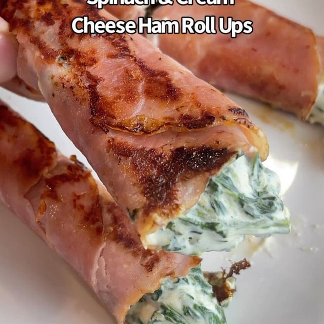 Say “YES” if you would eat these Cream Cheese &amp; Spinach Ham Roll Ups 😋🙌 Ingredients: Cooked spinach Cream cheese Ham Instructions: 1. Combine your spinach &amp; cream cheese. 2. Add to your ham and roll it up. 3. Pan fry on medium heat and turn until