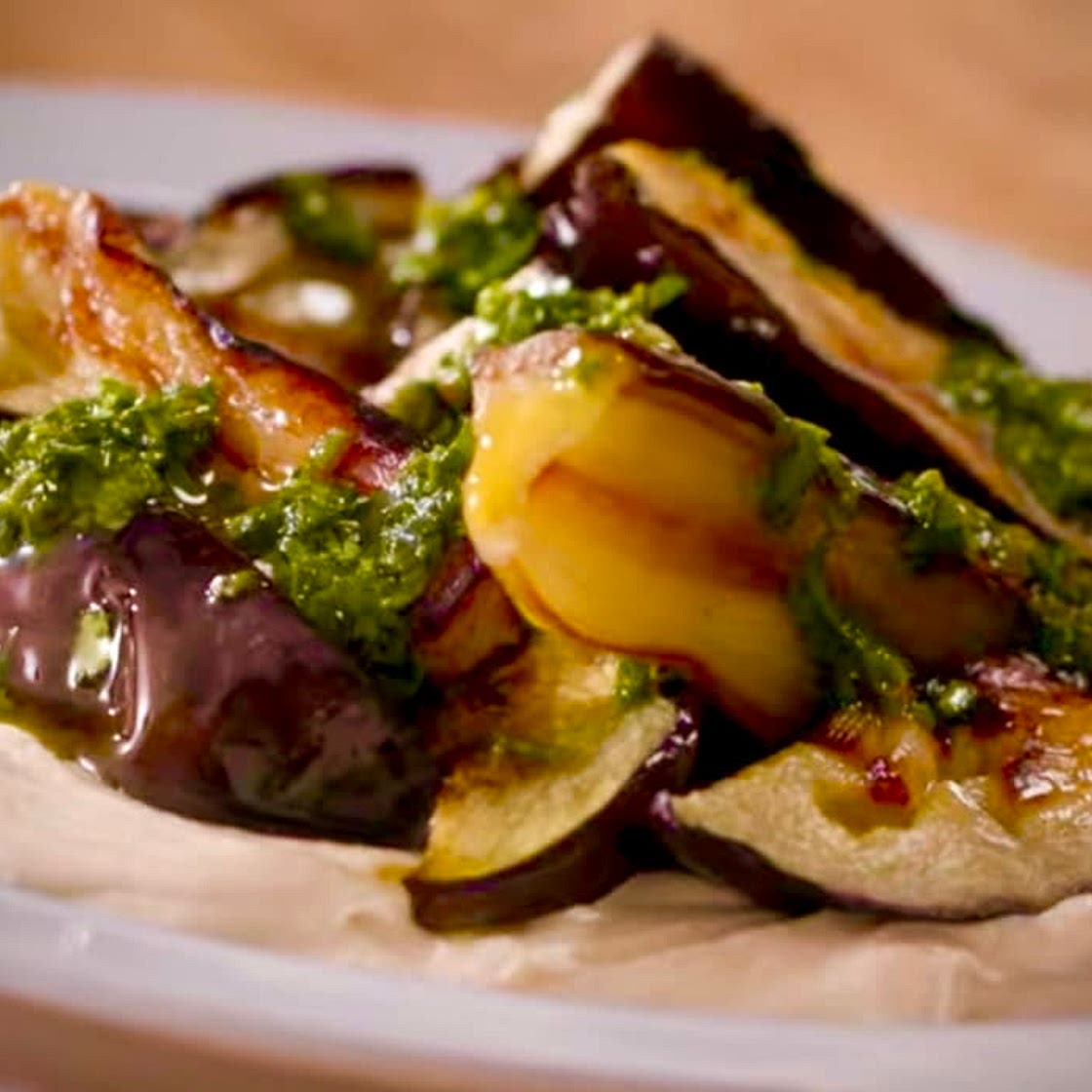 Roasted Eggplant with Hummus & Green Sauce. 