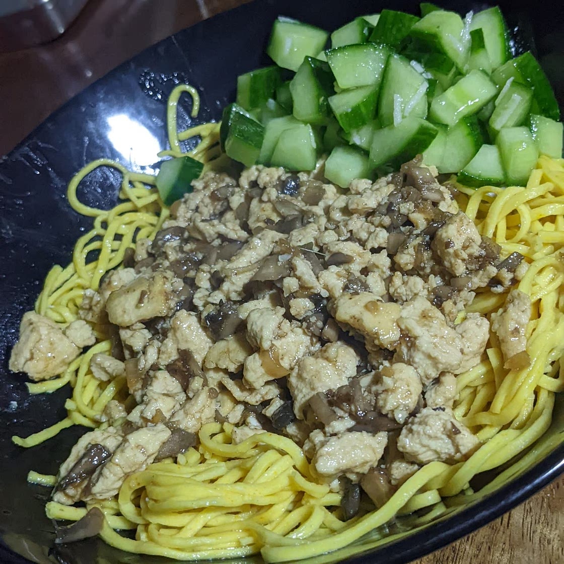 Spicy Garlic Noodles with Crumbled Tofu and Cucumber Salad