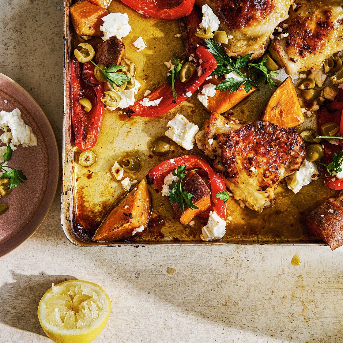 Roast chicken thighs with red peppers, sweet potatoes, green olives and feta recipe