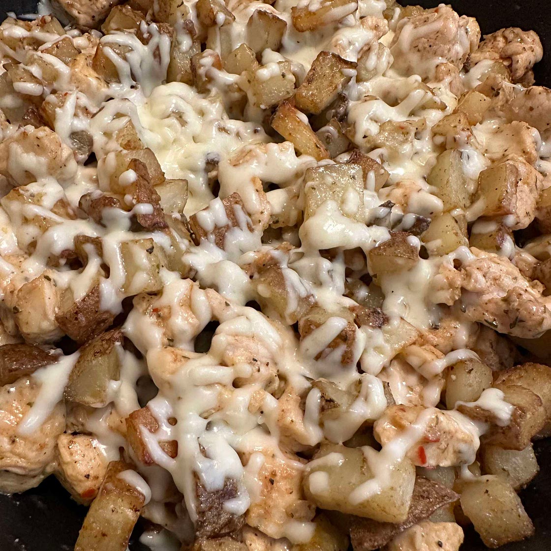 cheesy garlic parm and potato skillet
