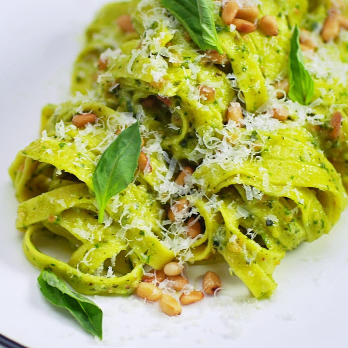 HOMEMADE PASTA WITH PESTO IN A PARMESAN WHEEL