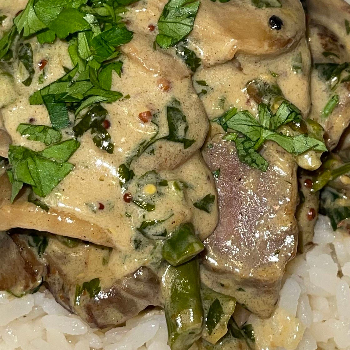 Steak in a Creamy Mushroom and Asparagus Sauce