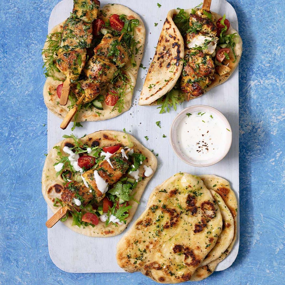 Spiced chicken skewers with garlic herb flatbreads