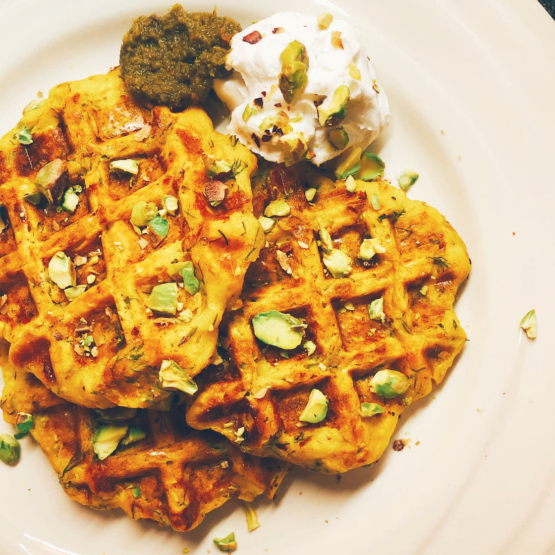 Zucchini waffles with pesto sauce & pistachios