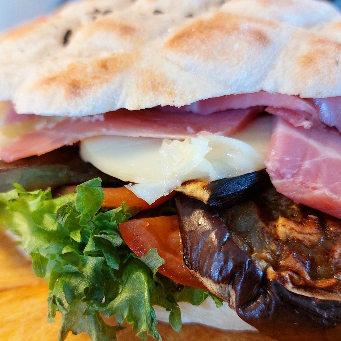 Panini - grilled eggplants, ham and scamorza chees sandwich