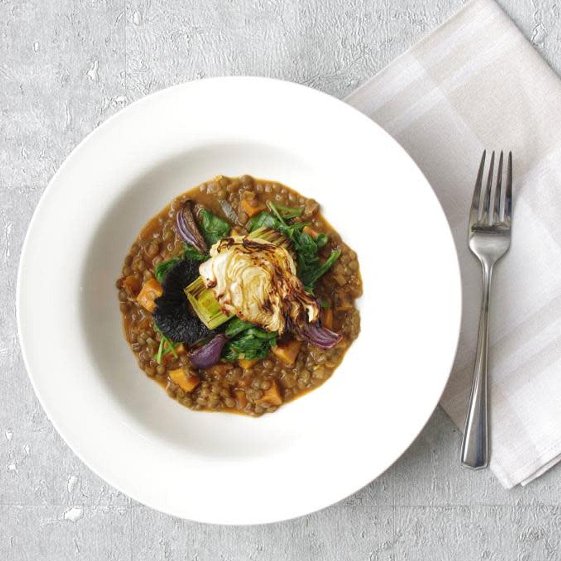 Lentil stew with sweet potatoes, wilted spinach and roasted cabbage