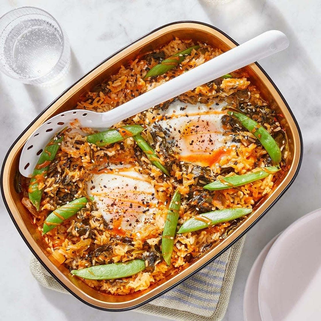 Oven-Baked Korean Eggs & Rice with Spinach, Kimchi & Sesame Seeds