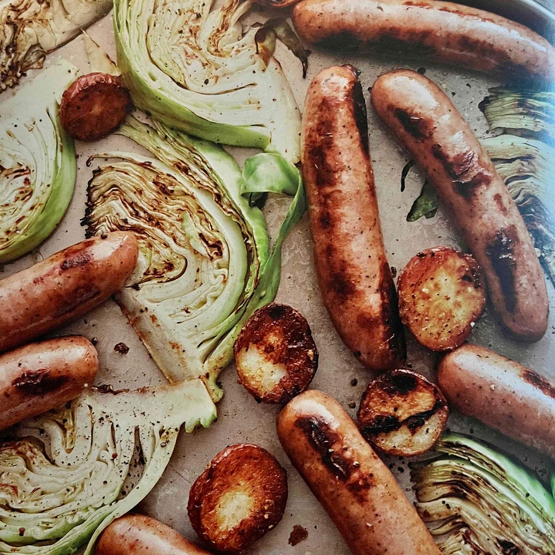 Roasted sausages with potatoes and cabbage