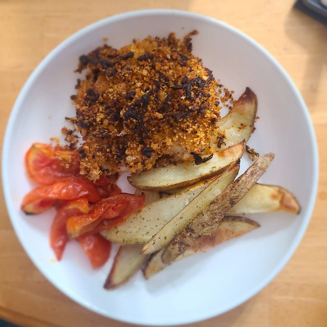 Mozzarella-Crusted Chicken with Blistered Tomatoes and Potato Wedges