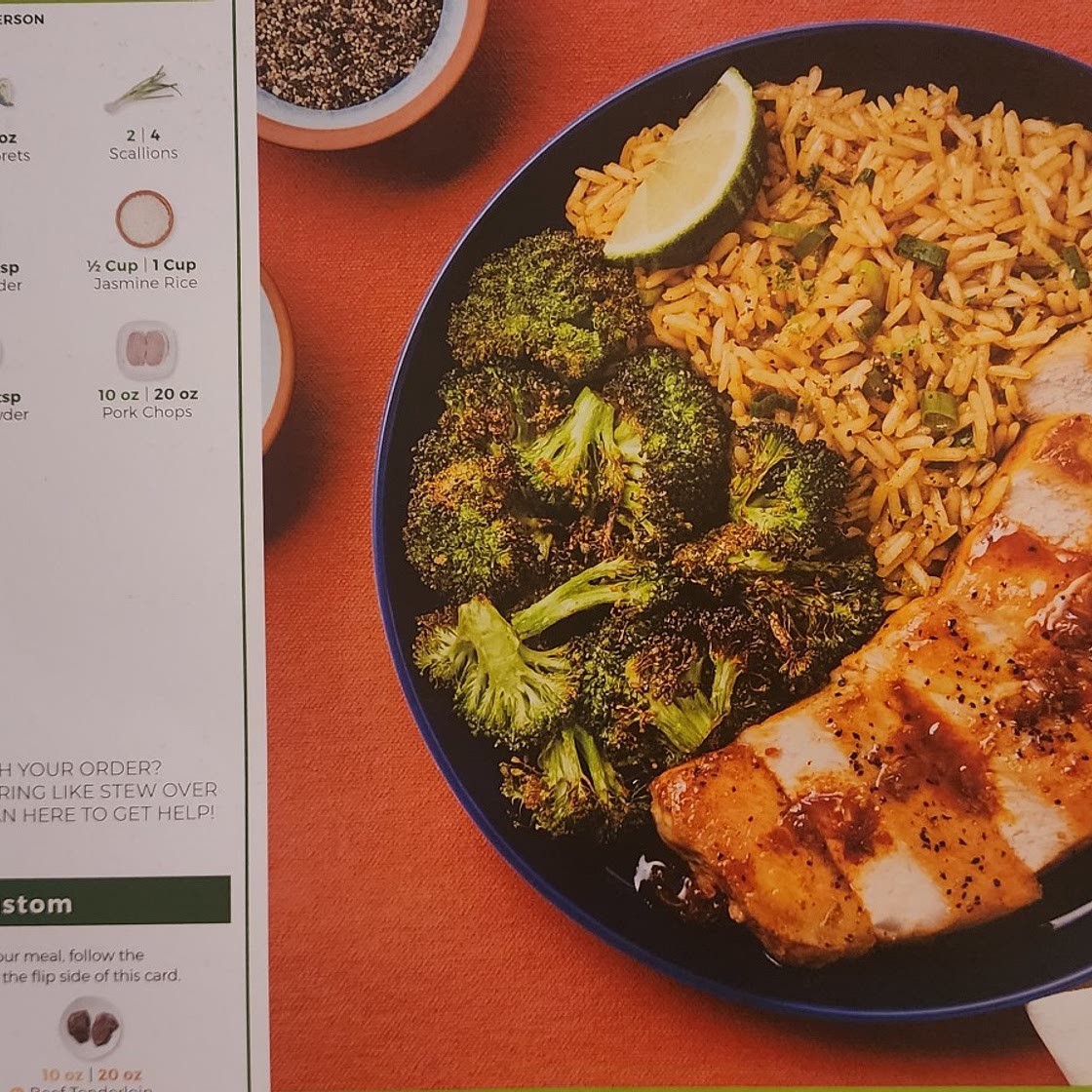 Red pepper jam pork chops with broccoli and scallion rice