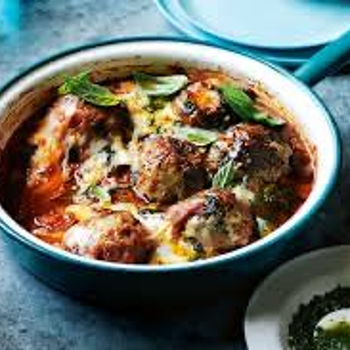 Oven-roasted meatballs with pesto and mozzarella