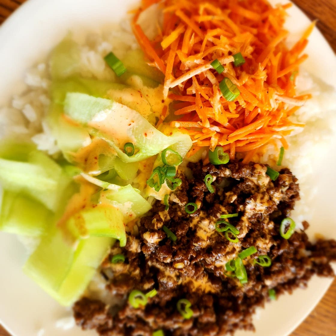 Ground Beef Bulgogi Bowls with Carrots, Cucumber, and Sriracha Crema over Jasmine Rice