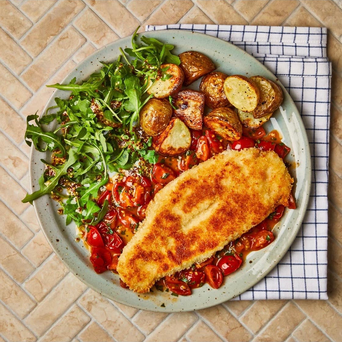 Breaded basa with tomato and basil sauce
