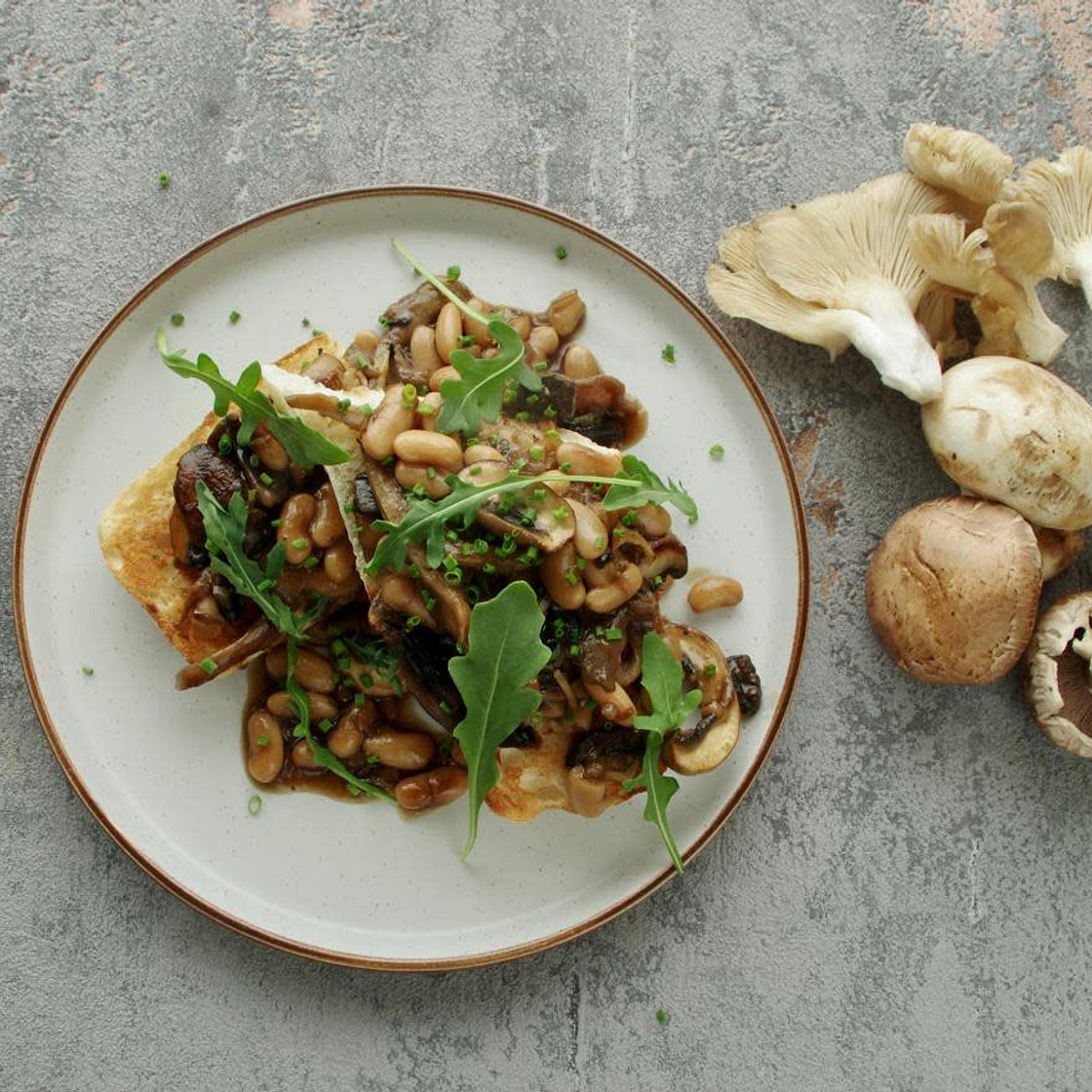Mixed mushrooms and creamy white beans on toast