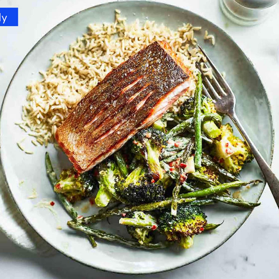 Salmon with roast broccoli and beans with tahini dressing