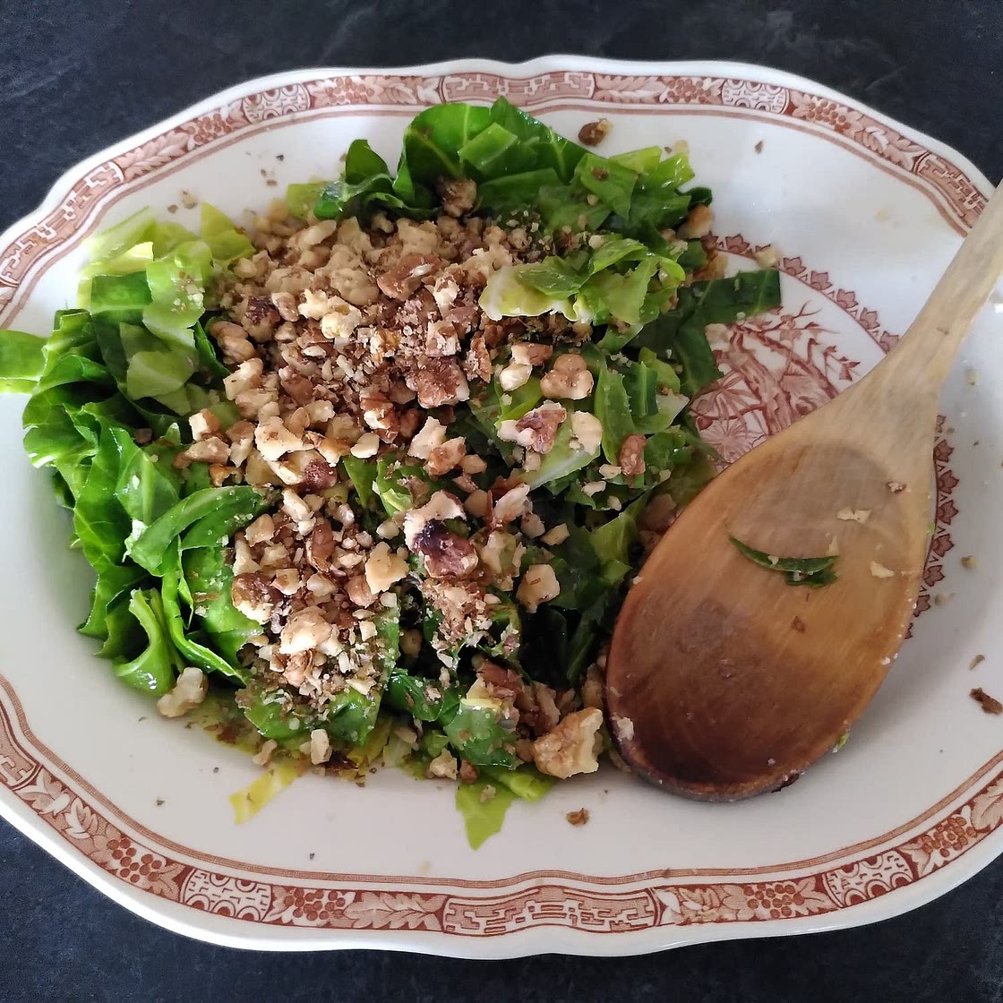 Wilted spring greens in nut oil