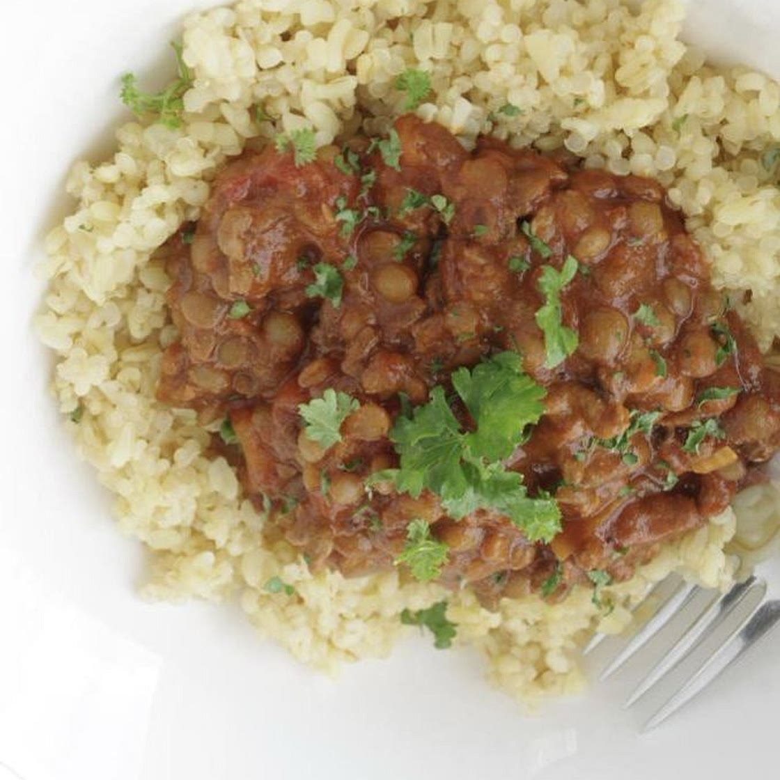 Stew lentils on a bed of bulgar wheat