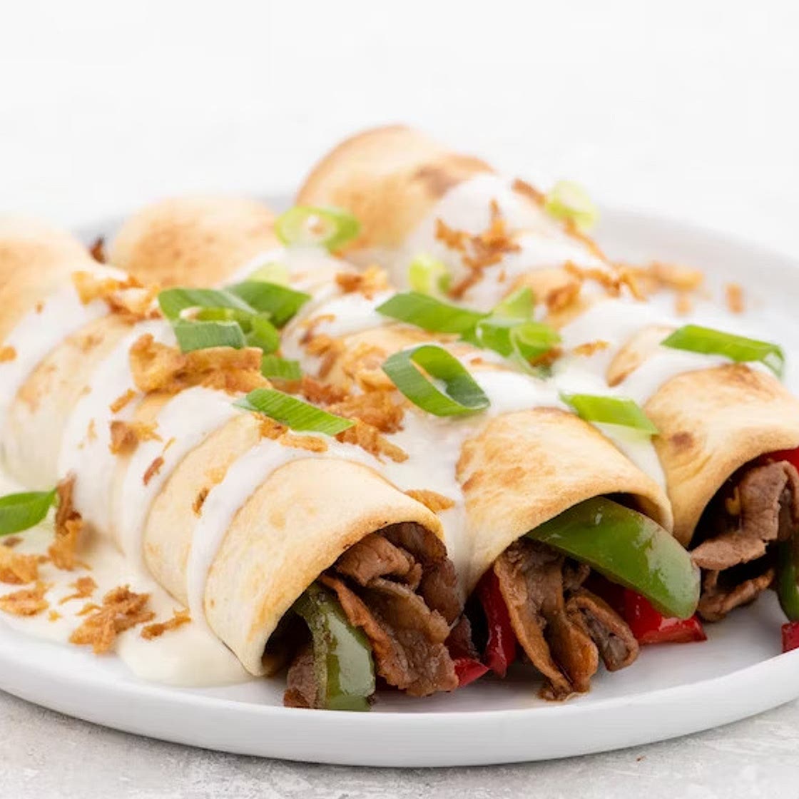 Philly Cheesesteak Enchiladas