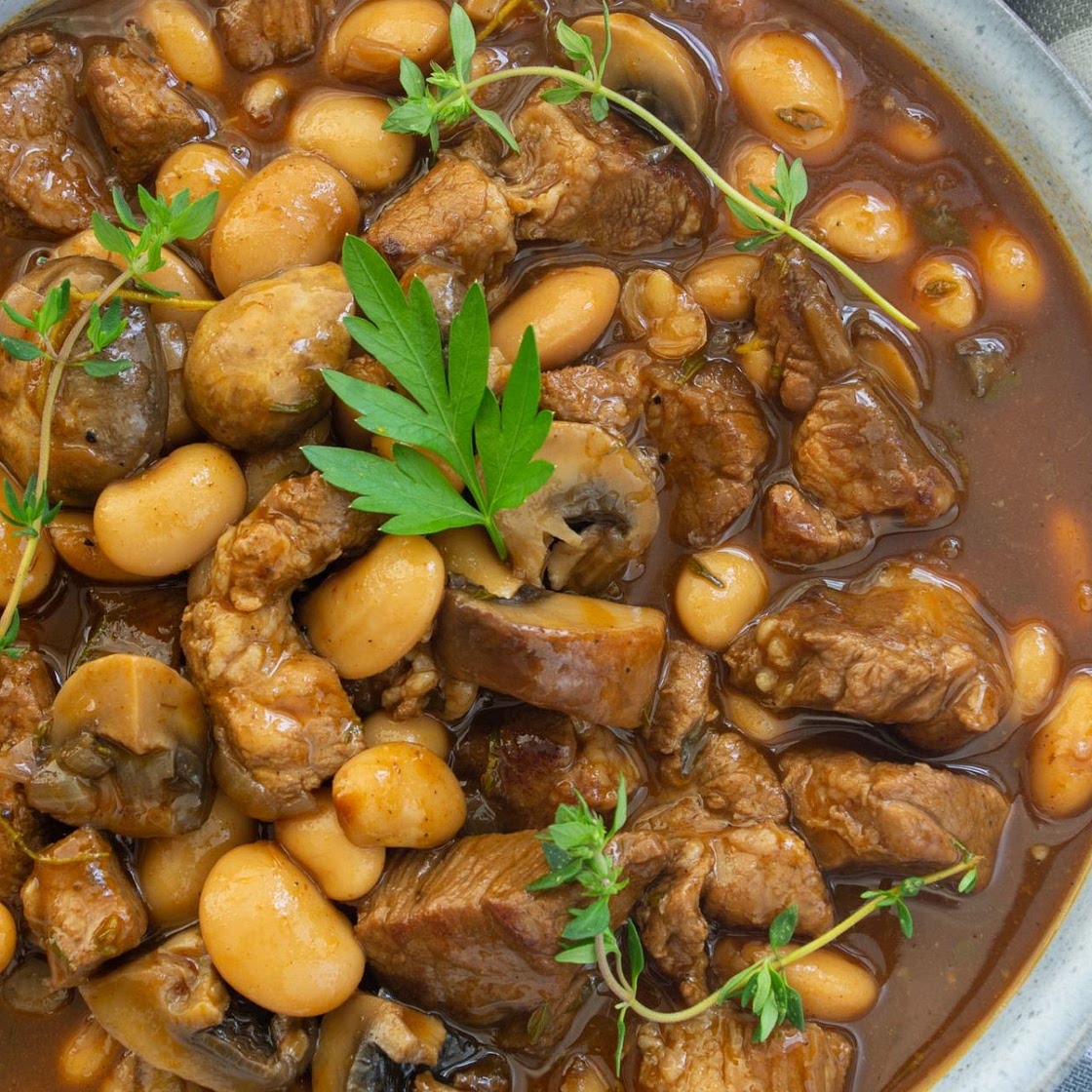 Braised pork with butter beans & mushrooms