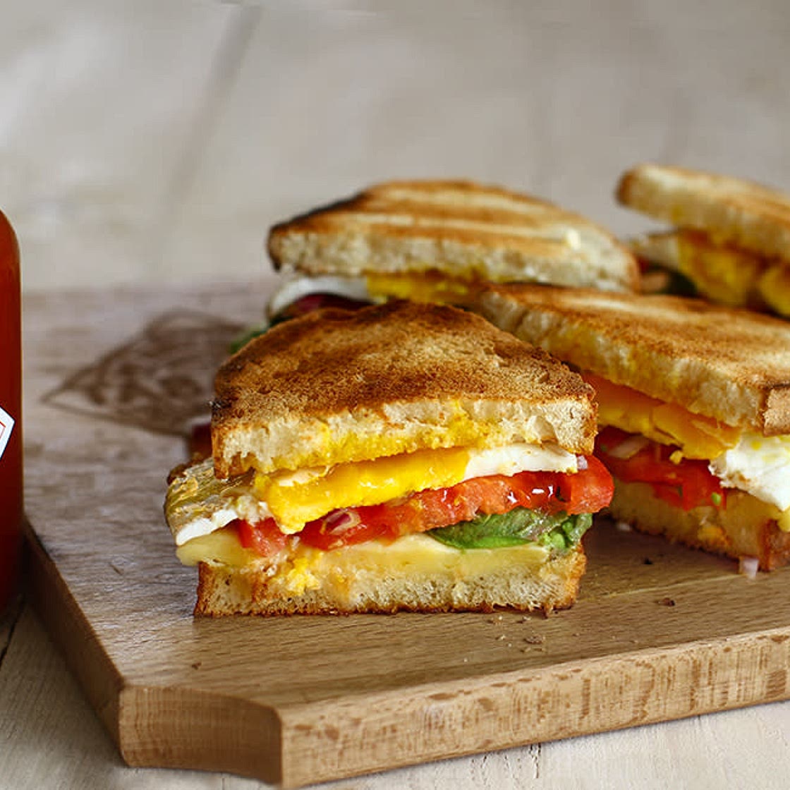Warm sandwich with cheese egg and avocado 