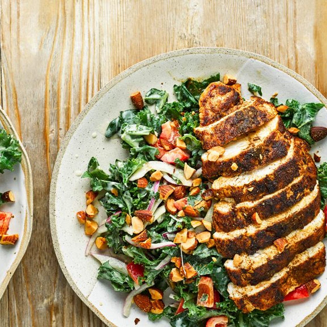 Cumin-crusted chicken with kale salad and hummus dressing