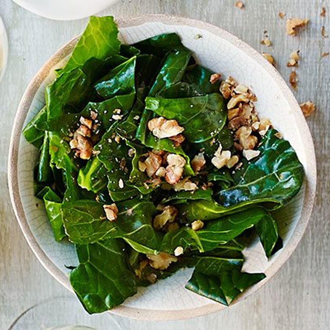 Wilted spring greens in nut oil
