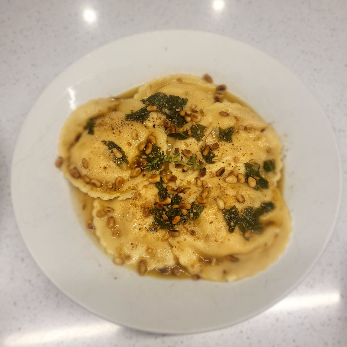 Pumpkin and feta ravioli  in butter and sage sauce