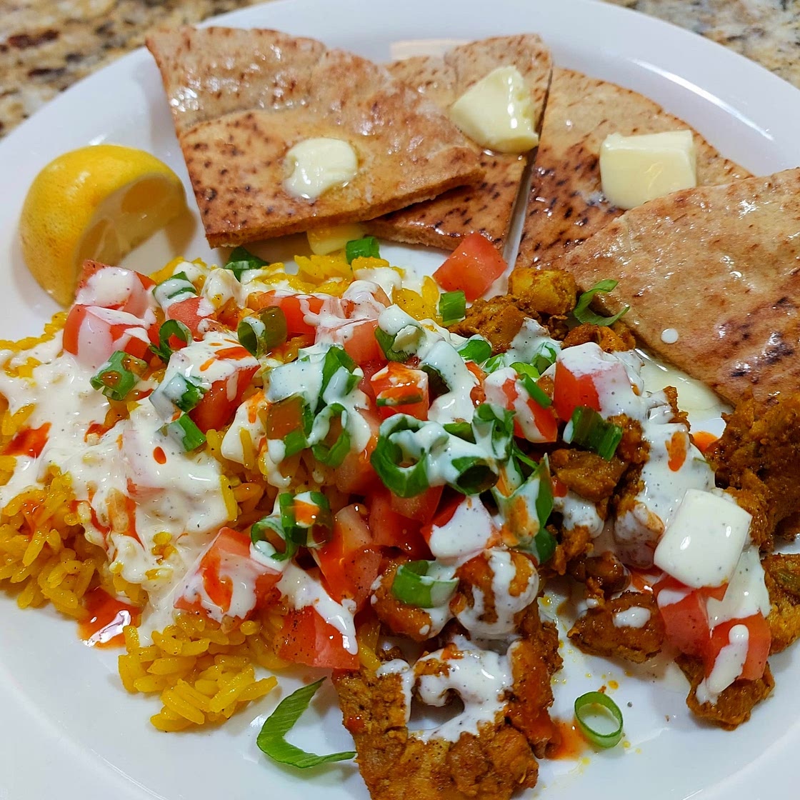Street Cart-Style Chicken Bowls with Yellow Rice, White Sauce & Pita Wedges