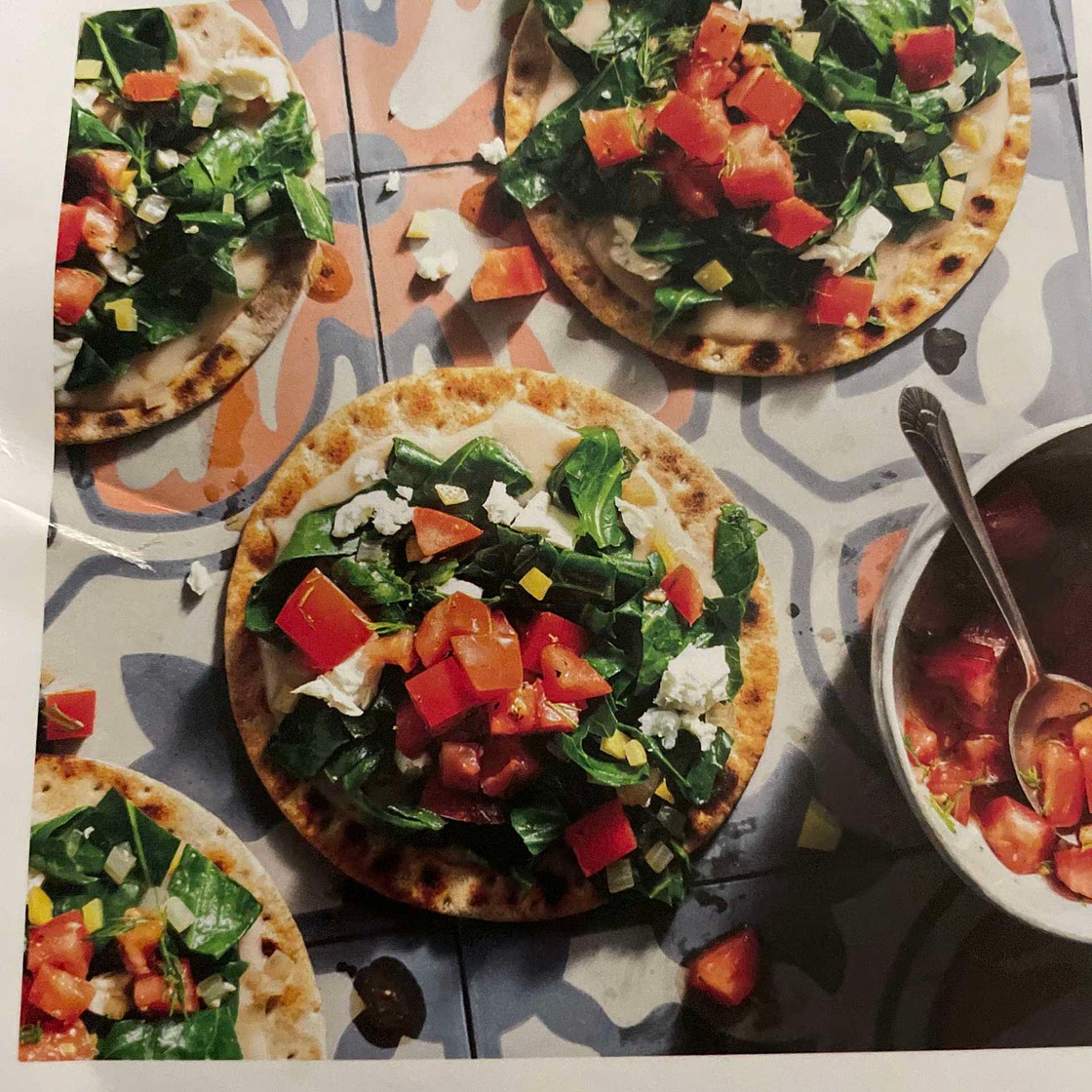 Istanbul flatbread with wilted greens, feta, and preserved lemon