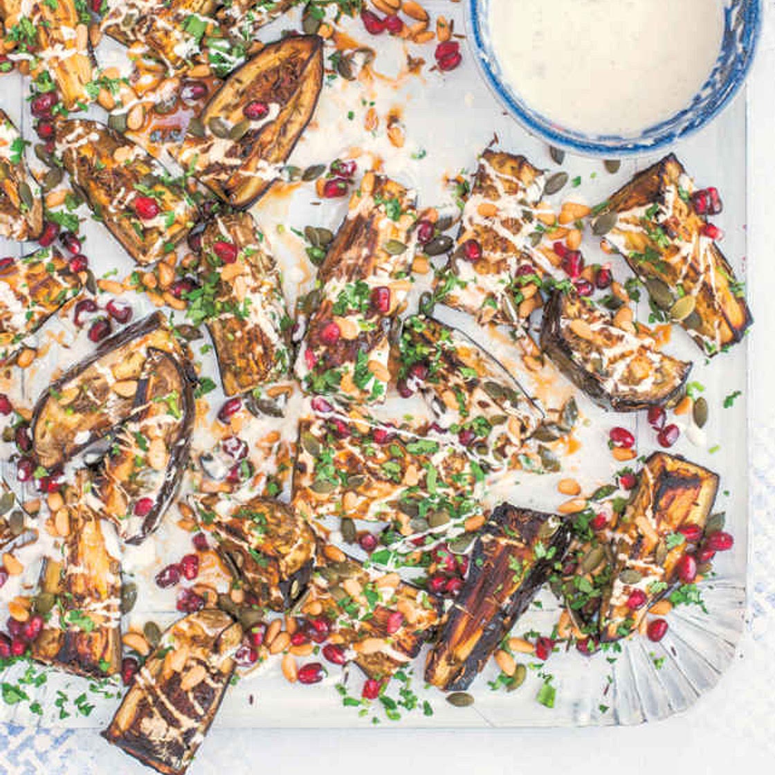 *0352kcal[9.0][10/10]* Cumin-Roasted Aubergine Wedges with Pumpkin Seeds, Pine Nuts, Pomegranate & Yogurt Dressing